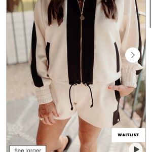 Emily McCarthy black and sand Bailey bomber jacket